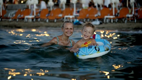 Mother and son with an inflatable ring