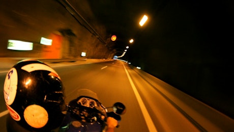 Motorbike racing through tunnels.