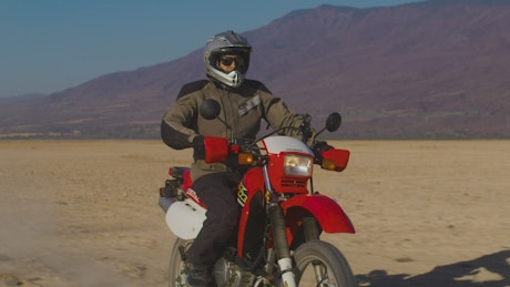 Motorcyclist in the arid desert