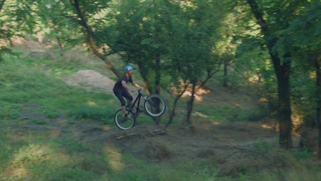 Mountain biker  speeding on the dirt path