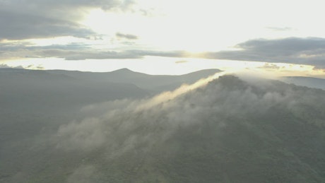 Mountain covered by fog in an aerial view.