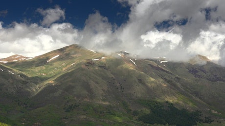 Mountain landscape with white clouds.