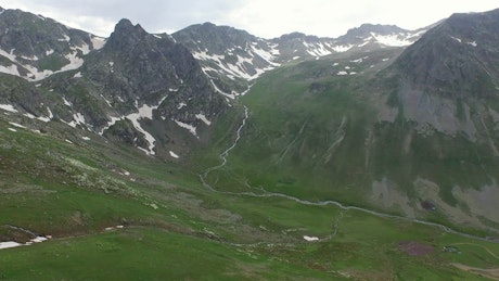 Mountain rocks and green valley