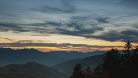 Mountainous landscape during dusk, time-lapse.