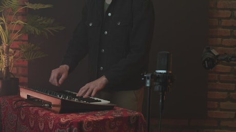 Musician playing a piano or a MIDI