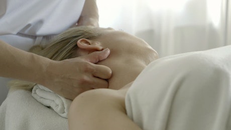 Neck massage by physiotherapist.