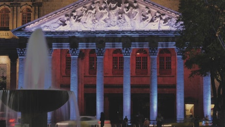 Neoclassical building illuminated at night
