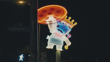 Neon sign of a character from a pizzeria