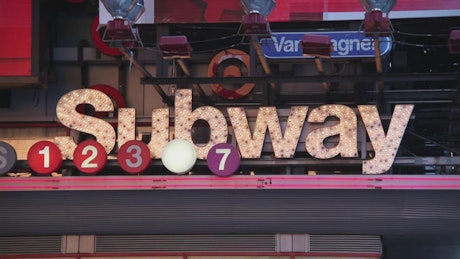Neon subway sign with numbers