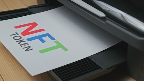 NFT Token Printing Inscription on a printer.