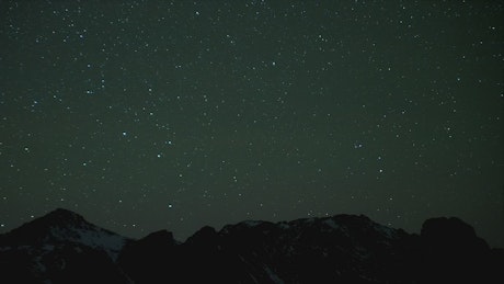 Night sky full of stars and mountain silhouette