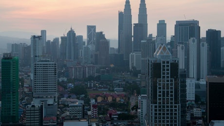 Nighttime Kuala Lumpur Skyline with Illuminated Buildings.