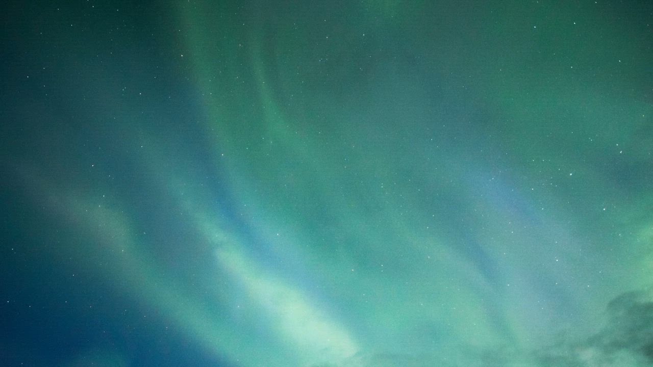Northern Lights of blue and green colors in the night sky - Free Video