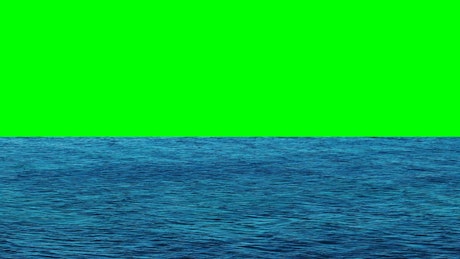Ocean waters with a green screen in the background.