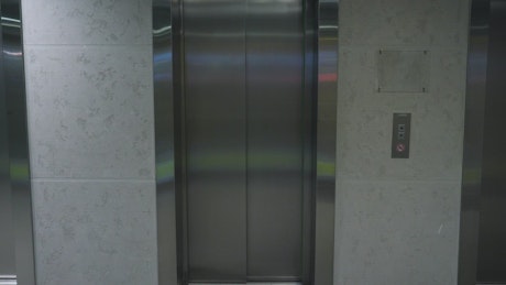 Office elevator with a green screen