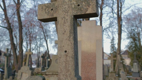 Old religious stone cross in a graveyard.