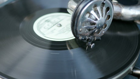 Old turntable playing a record.