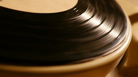 Old vinyl record playing.