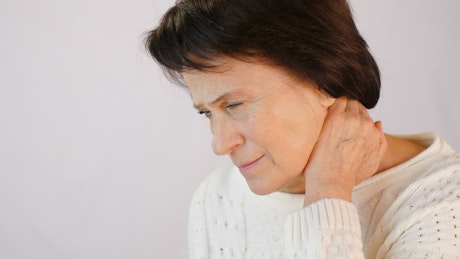 Older woman with neck tension