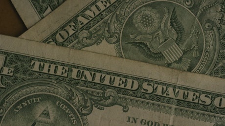 One dollar bills rotating.