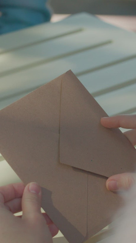 Opening an envelope with a Valentine's card.
