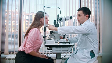 Ophthalmologist and a patient during an eyesight test