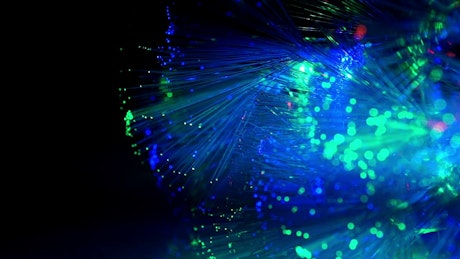 Optic fiber glowing in blue.