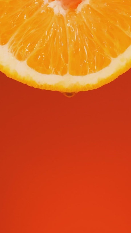 Orange slice on an orange background.
