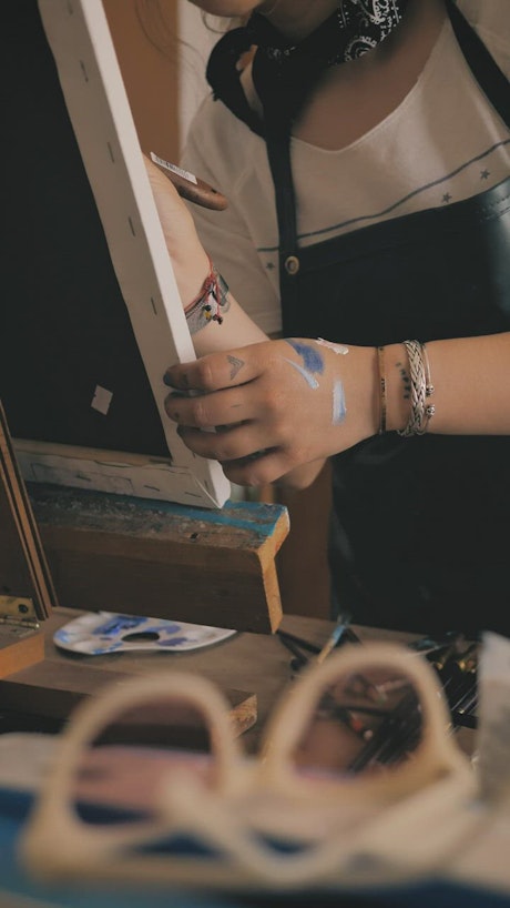 Painting on a canvas on a wooden easel.