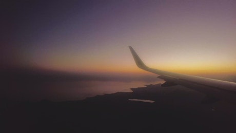 Panorama from the window of an airplane at dusk.