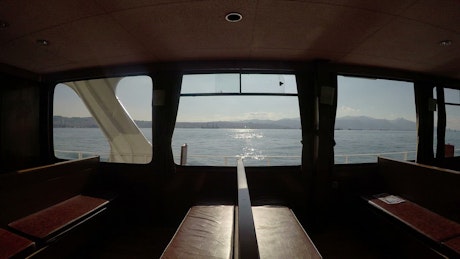 Panoramic view of the sea from inside a ferry.