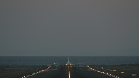 Passenger plane taking off at dusk