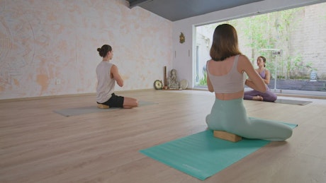 People doing yoga and meditation together