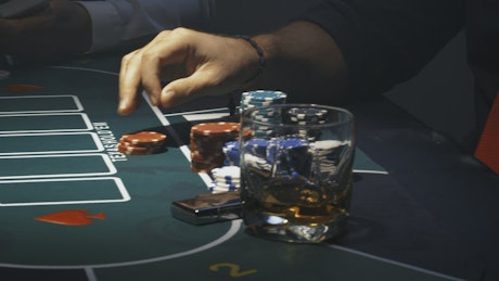 People playing poker at a casino.