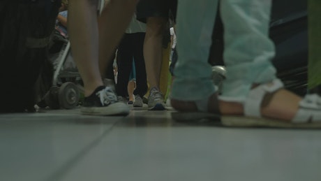 People walking around an airport