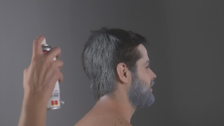 Person painting the hair of a winter model
