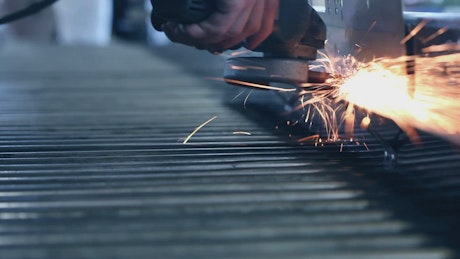 Person using an industrial grinder