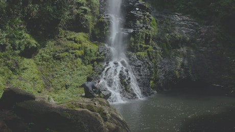 Photographer shooting waterfall.