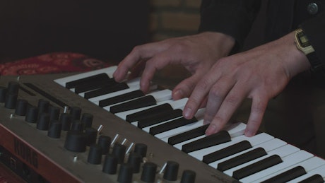 Pianist playing chords on a synthesizer