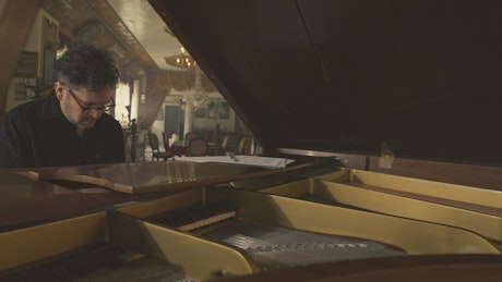 Pianist playing in an elegant hall