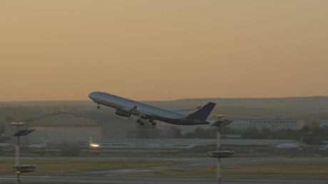 Plane taking off at dusk