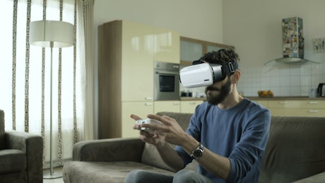 Playing a video game using VR headset.