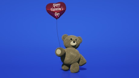 Plush teddy bear on blue background walking with a balloon.