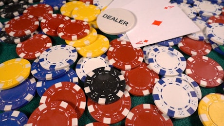 Poker hand of 4 aces at a poker table.