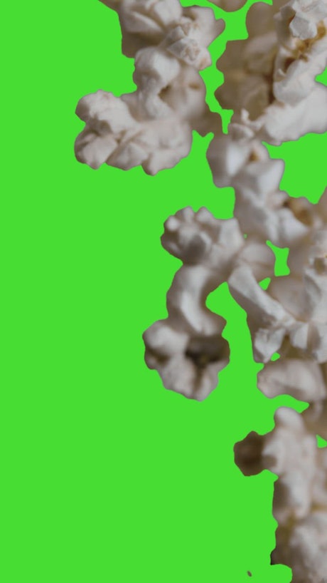 Popcorn moving on a green background.