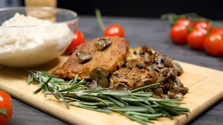 Pork chops with mushrooms in a restaurant.