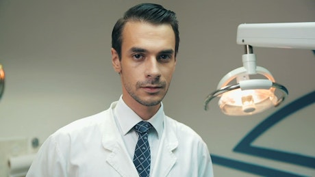 Portrait of a dentist in his dental office