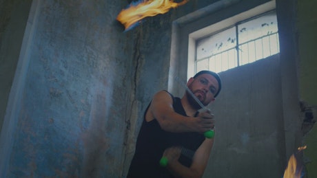 Portrait of a man doing tricks with fireballs
