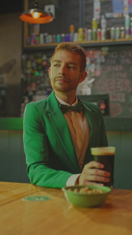 Portrait of a man in a bar on Saint Patrick's Day.