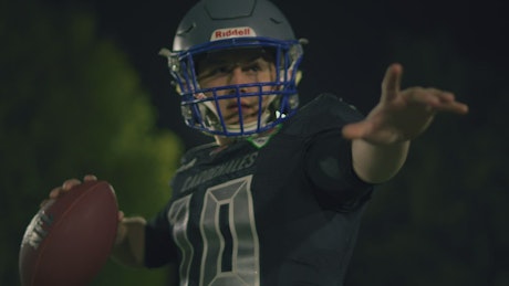 Portrait of a quarterback throwing the ball